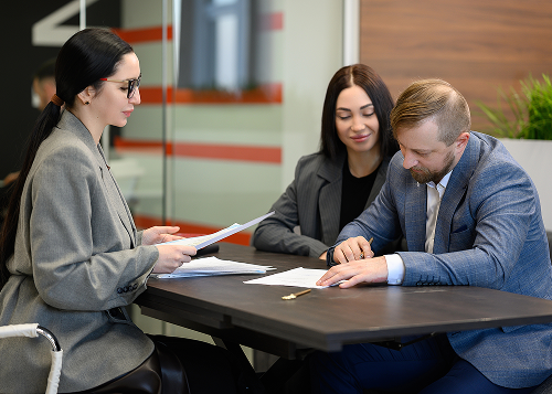 Couple signing lease agreement